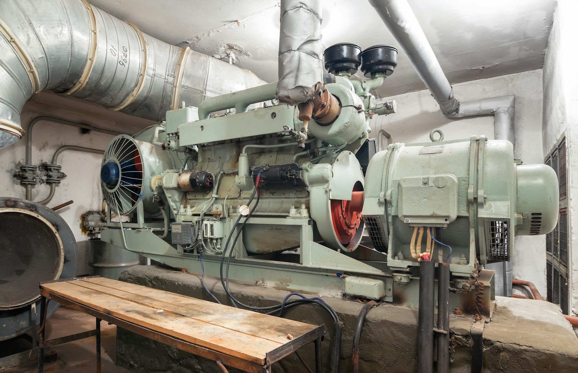 Big old diesel generator inside an shelter